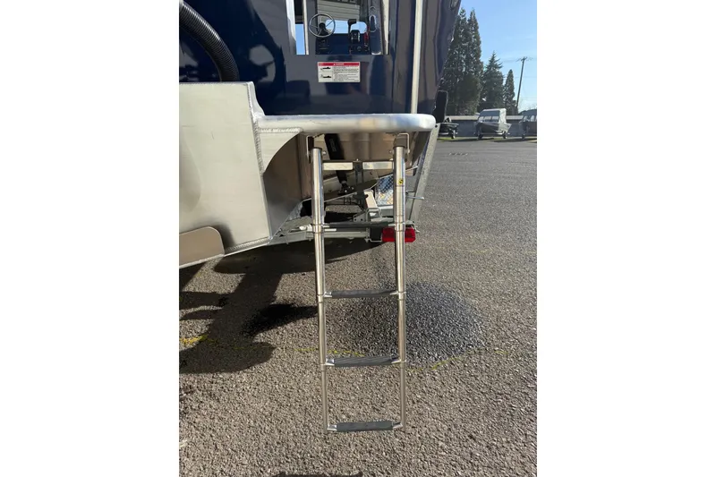 Slide: The Image of 2025 Thunder Jet 24 Alexis Pro boat with a metal boarding ladder. - 27