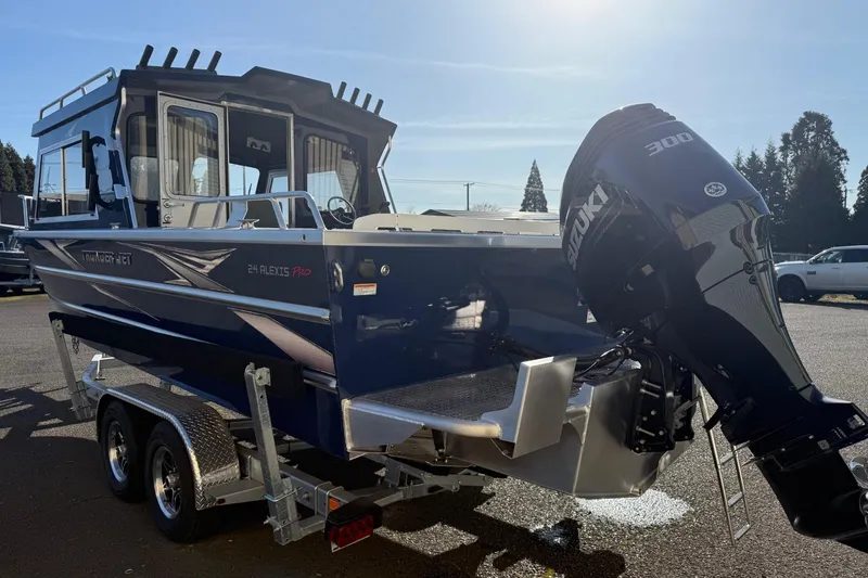 Slide: The Image of 2025 Thunder Jet 24 Alexis Pro boat with Suzuki 300 outboard motor on trailer. - 3