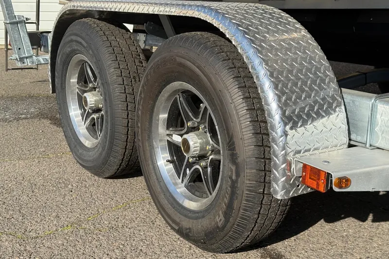 Slide: The Image of Close-up of 2025 Thunder Jet 24 Alexis Pro trailer wheels with diamond plate fender. - 32