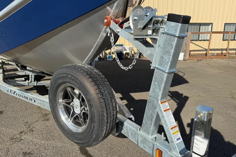 Slide: The Image of Trailer for 2025 Thunder Jet 24 Alexis Pro boat, featuring EZ Loader system. - 33