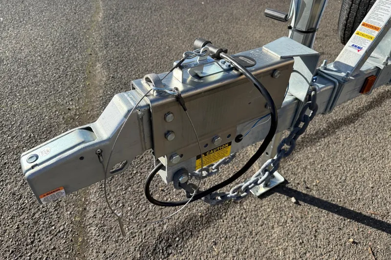 Slide: The Image of Trailer hitch of 2025 Thunder Jet 24 Alexis Pro on asphalt surface. - 36