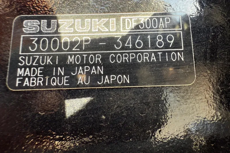Slide: The Image of Suzuki motor label on Thunder Jet 24 Alexis Pro, 2025 model, made in Japan. - 41