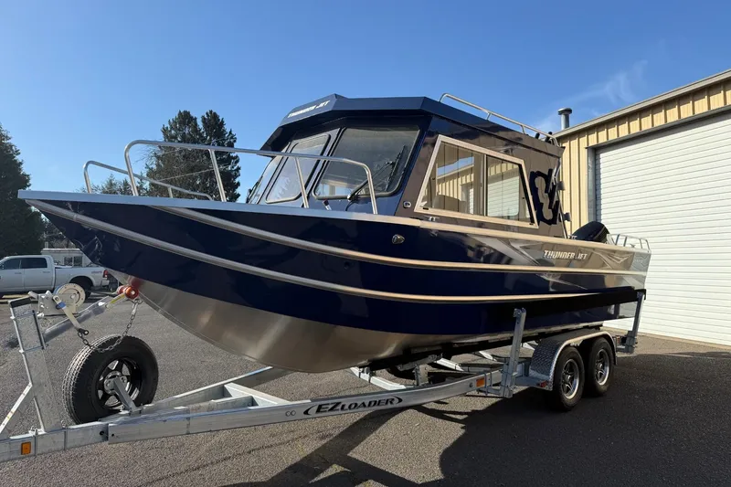 Slide: The Image of 2025 Thunder Jet 24 Alexis Pro boat on trailer, parked outdoors. - 5