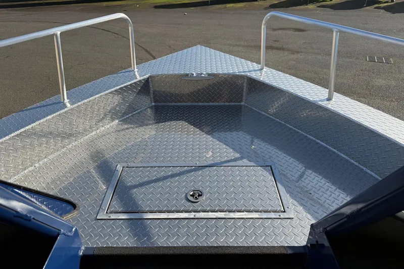 Slide: The Image of 2025 Thunder Jet 24 Alexis Pro boat deck with diamond plate flooring and railing. - 6