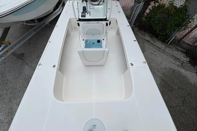 Slide: The Image of 2026 Spyder FX19 Vapor boat interior, featuring a sleek white deck and modern console. - 10