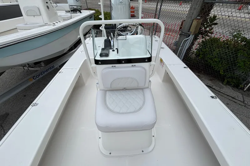 Slide: The Image of 2026 Spyder FX19 Vapor boat interior with white seating and steering console. - 12