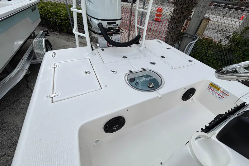 Slide: The Image of 2026 Spyder FX19 Vapor boat deck with storage compartments and motor mount. - 15