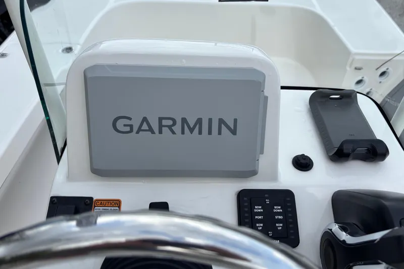 Slide: The Image of 2026 Spyder FX19 Vapor boat dashboard with Garmin navigation system. - 19