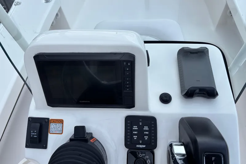 Slide: The Image of 2026 Spyder FX19 Vapor boat dashboard with Garmin display and controls. - 20