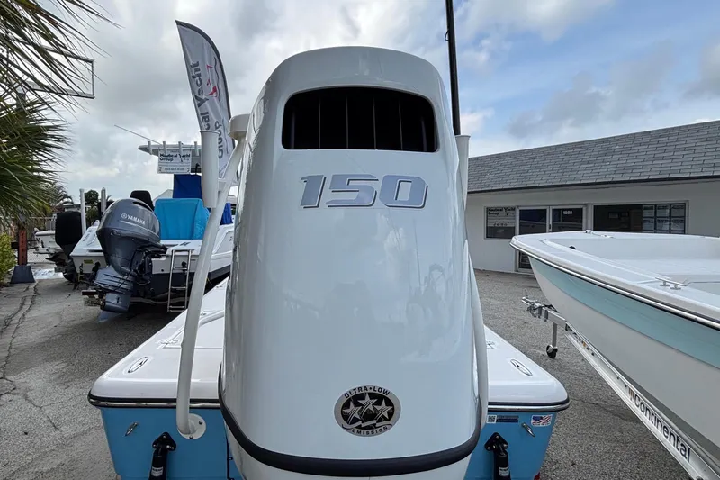 Slide: The Image of 2026 Spyder FX19 Vapor boat with Yamaha 150 engine, displayed outdoors. - 4