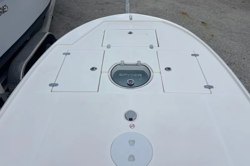 Slide: The Image of 2026 Spyder FX19 Vapor boat deck with storage compartments and logo. - 8