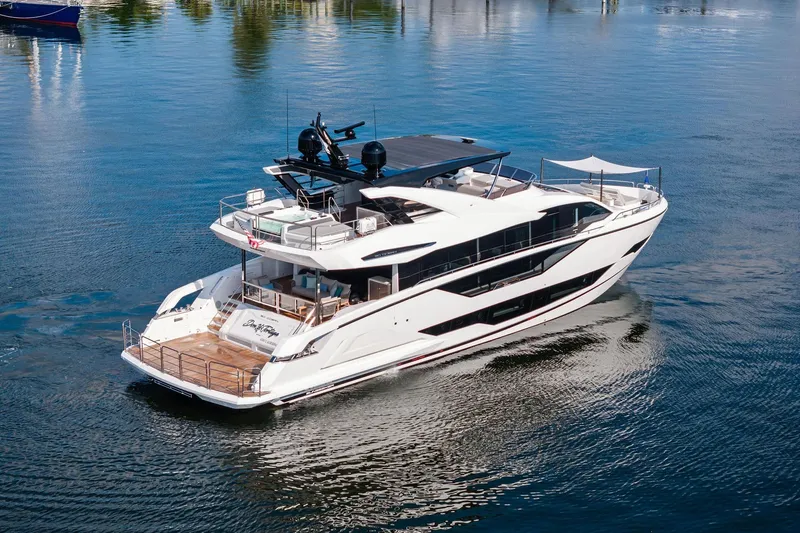 Slide: The Image of 2024 Sunseeker 90 Ocean luxury yacht cruising on calm waters. - 1