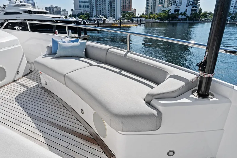 Slide: The Image of Luxurious seating area on 2024 Sunseeker 90 Ocean yacht, docked in a marina. - 12
