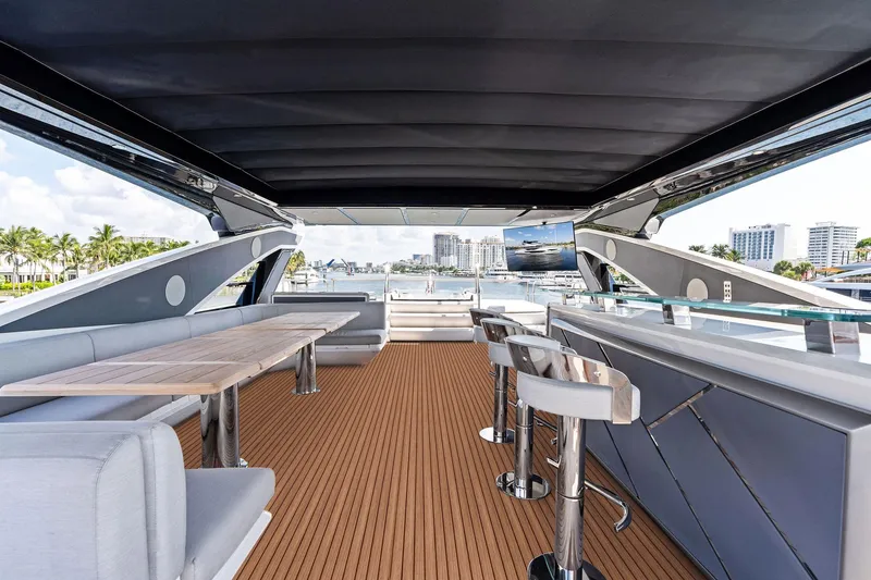 Slide: The Image of Luxurious 2024 Sunseeker 90 Ocean yacht interior with elegant seating and bar area. - 17