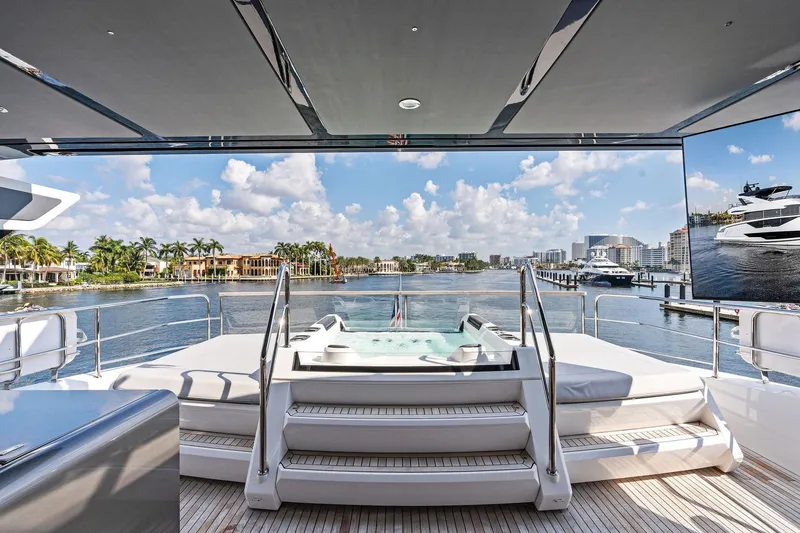 Slide: The Image of Luxurious 2024 Sunseeker 90 Ocean yacht with jacuzzi, overlooking scenic waterfront views. - 20