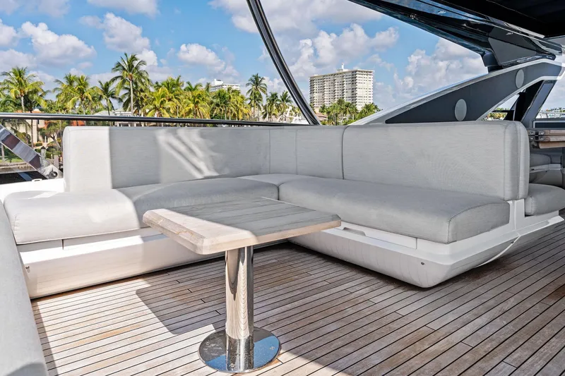Slide: The Image of Luxurious Sunseeker 90 Ocean 2024 yacht deck with elegant seating and table. - 23