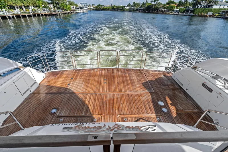 Slide: The Image of 2024 Sunseeker 90 Ocean yacht deck with scenic waterway view. - 28