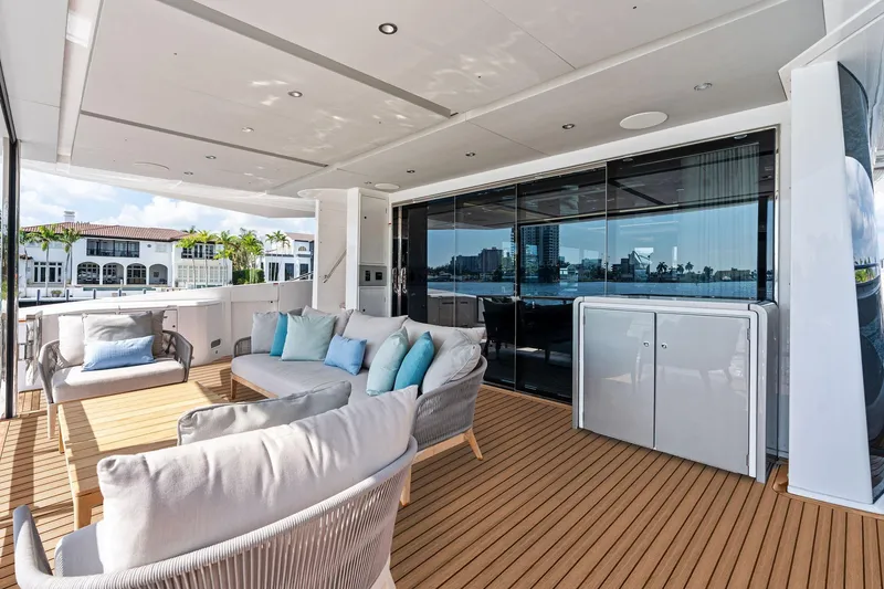 Slide: The Image of Luxurious 2024 Sunseeker 90 Ocean yacht deck with elegant seating and waterfront view. - 31