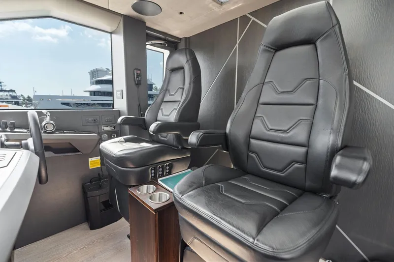 Slide: The Image of Interior of 2024 Sunseeker 90 Ocean yacht with luxurious black leather seats. - 39