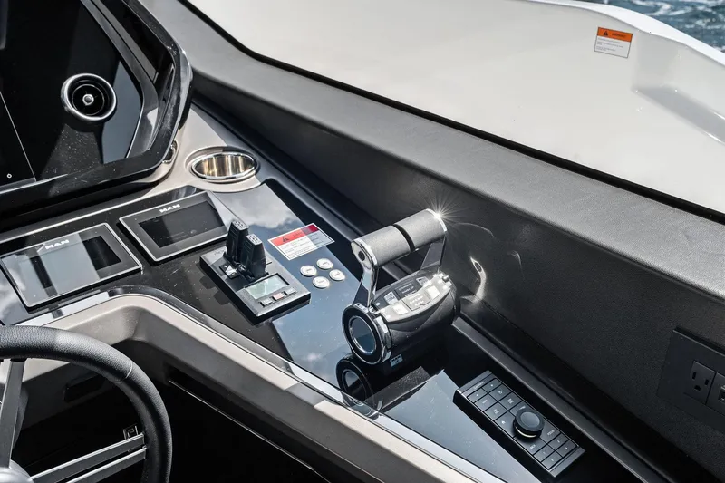 Slide: The Image of 2024 Sunseeker 90 Ocean yacht control panel with modern navigation instruments. - 40