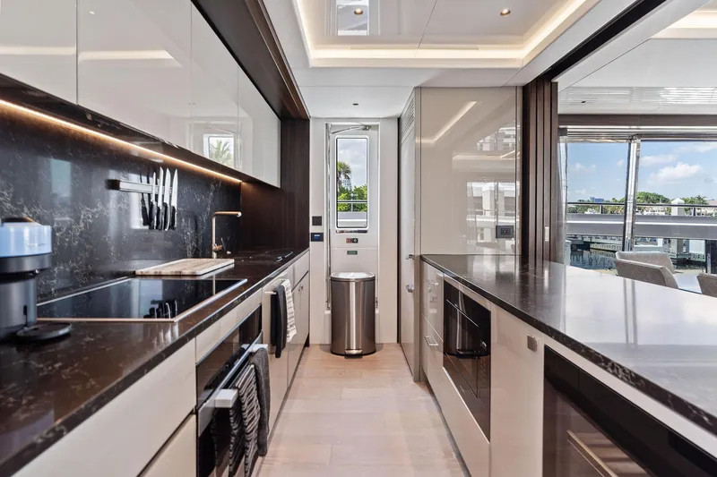 Slide: The Image of Luxurious kitchen interior of 2024 Sunseeker 90 Ocean yacht with modern appliances and sleek design. - 45