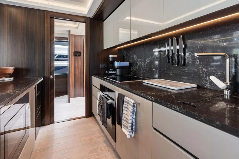Slide: The Image of Luxurious kitchen interior of 2024 Sunseeker 90 Ocean yacht with modern design. - 47