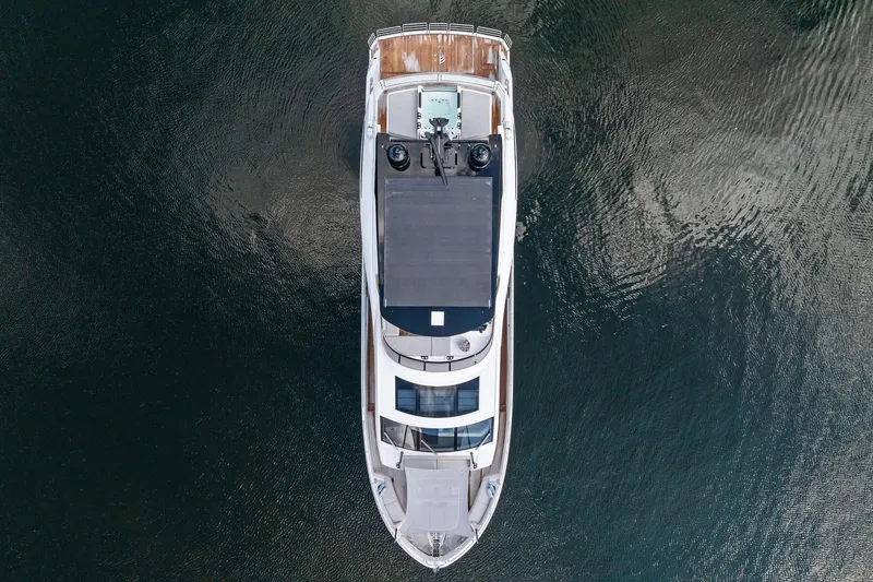 Slide: The Image of Aerial view of 2024 Sunseeker 90 Ocean yacht on calm water. - 5
