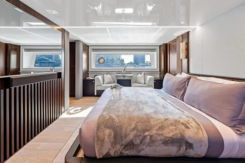 Slide: The Image of Luxurious interior of 2024 Sunseeker 90 Ocean yacht with elegant bedroom and scenic window view. - 51