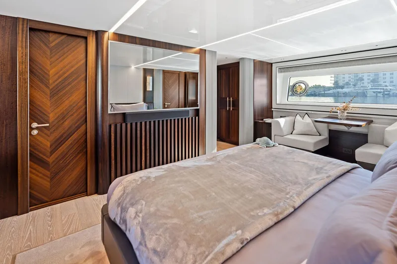 Slide: The Image of Luxurious interior of 2024 Sunseeker 90 Ocean yacht with elegant wood finishes. - 52