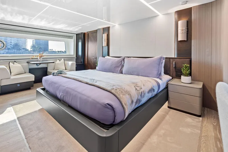Slide: The Image of Luxurious bedroom interior of 2024 Sunseeker 90 Ocean yacht with modern design and large window. - 53