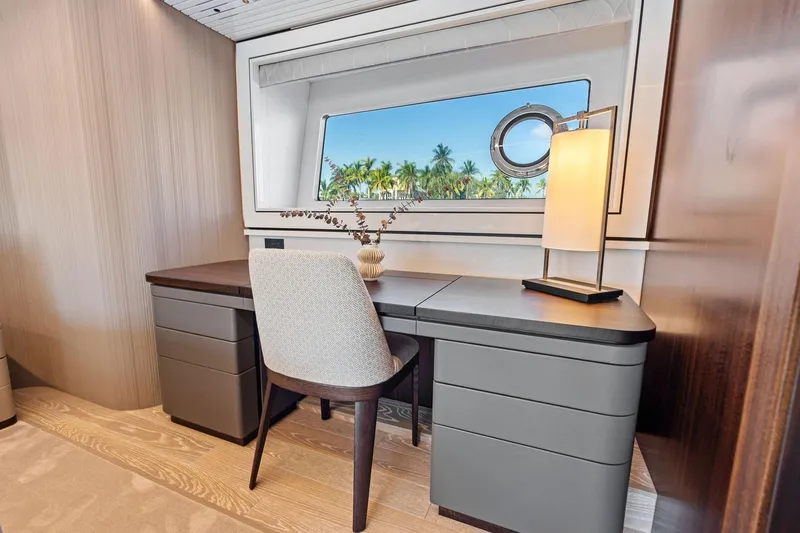 Slide: The Image of Luxurious interior of 2024 Sunseeker 90 Ocean yacht with elegant desk and ocean view. - 56