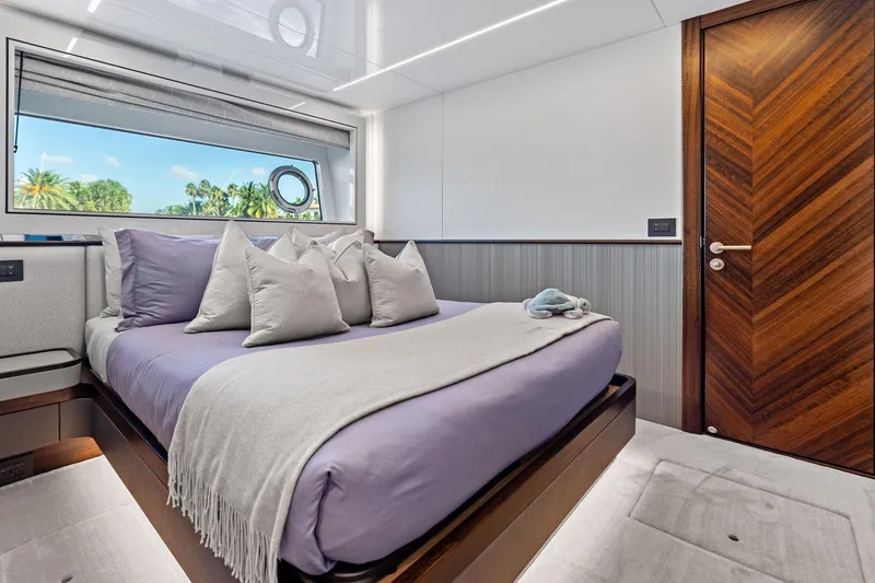 Slide: The Image of Luxurious bedroom interior of 2024 Sunseeker 90 Ocean yacht with elegant wood accents. - 60