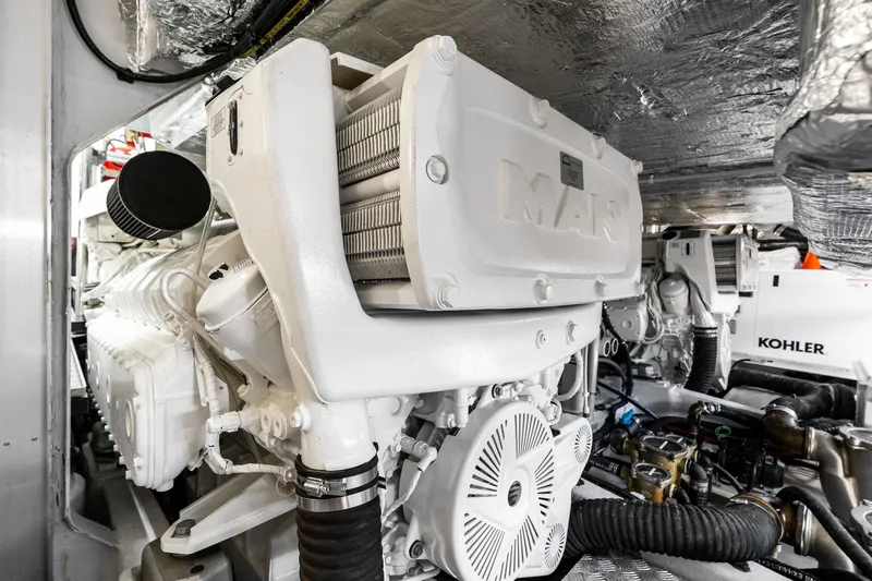 Slide: The Image of Engine room of 2024 Sunseeker 90 Ocean yacht, featuring advanced machinery and equipment. - 66