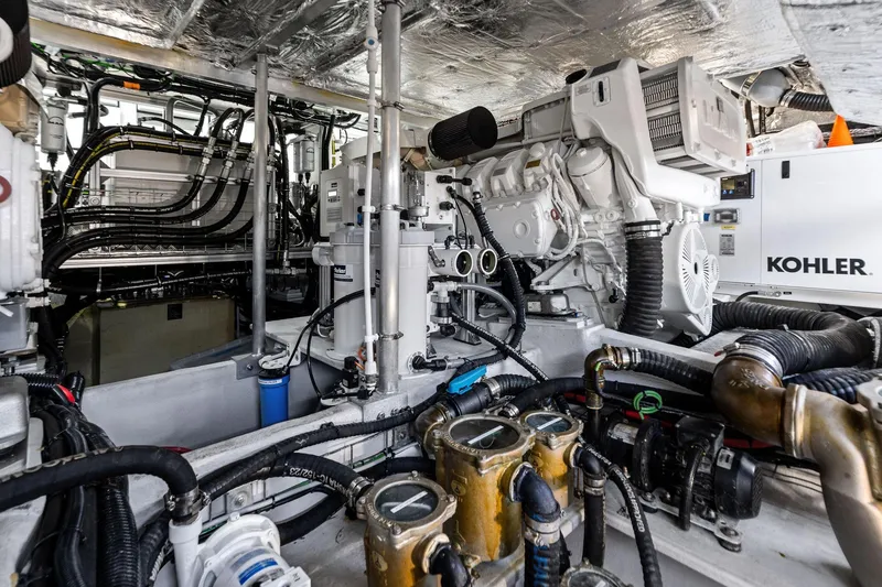 Slide: The Image of Engine room of 2024 Sunseeker 90 Ocean yacht with Kohler generator and complex machinery. - 67
