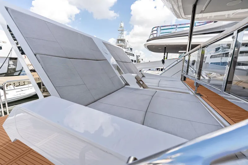Slide: The Image of Luxurious 2024 Sunseeker 90 Ocean yacht with sleek deck seating and modern design. - 7