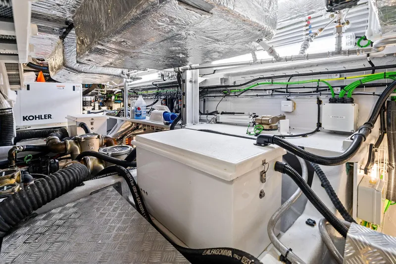 Slide: The Image of Engine room of 2024 Sunseeker 90 Ocean yacht with Kohler generator and advanced wiring. - 73