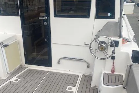 Slide: The Image of 2020 Cutwater C-32 C boat cockpit with steering wheel and deck view. - 14