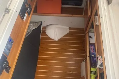 Slide: The Image of 2020 Cutwater C-32 C cabin interior with wood flooring and storage compartments. - 19