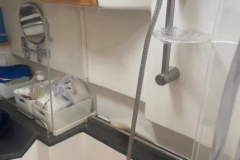 Slide: The Image of 2020 Cutwater C-32 C boat interior with shower and storage area. - 22