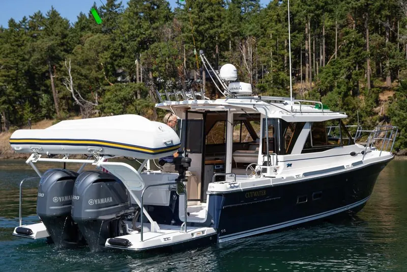 Slide: The Image of Manufacturer Provided Image: 2020 Cutwater C-32 C boat with Yamaha engines on a calm lake. - 5