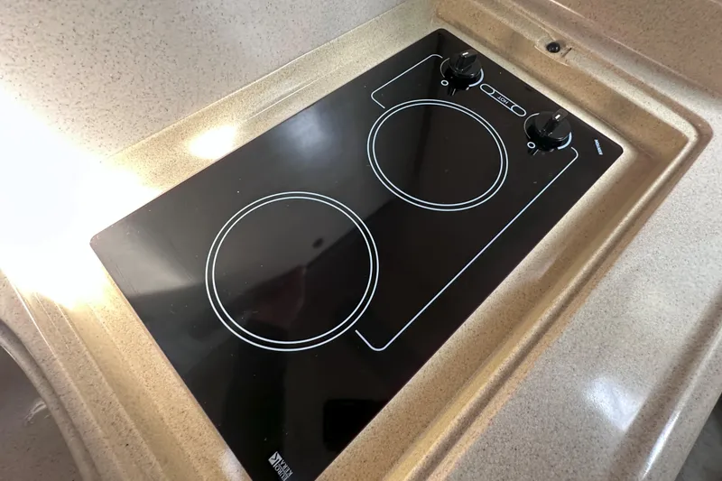 Slide: The Image of Built-in electric stove on 2000 Sea Ray 290 Sundancer yacht kitchen counter. - 14