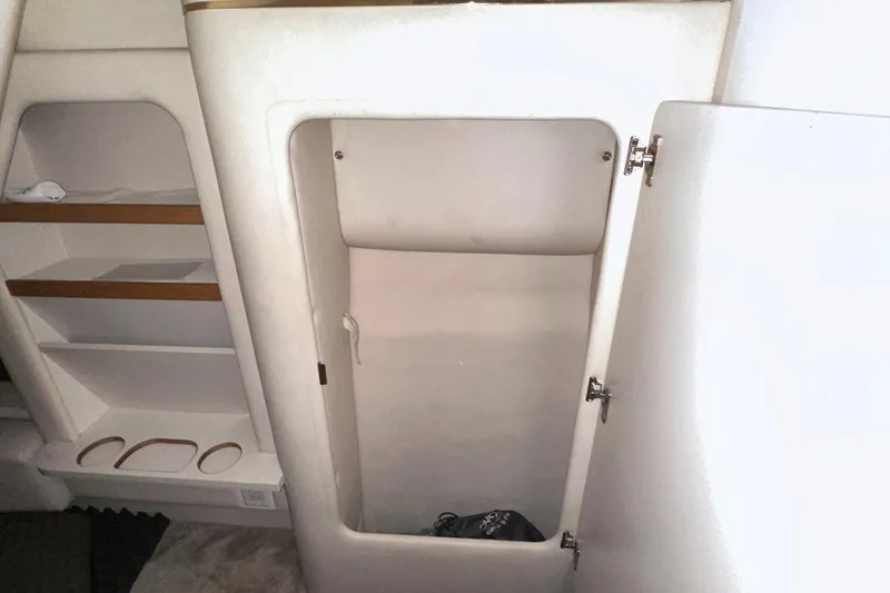 Slide: The Image of Interior storage compartment of 2000 Sea Ray 290 Sundancer boat. - 18