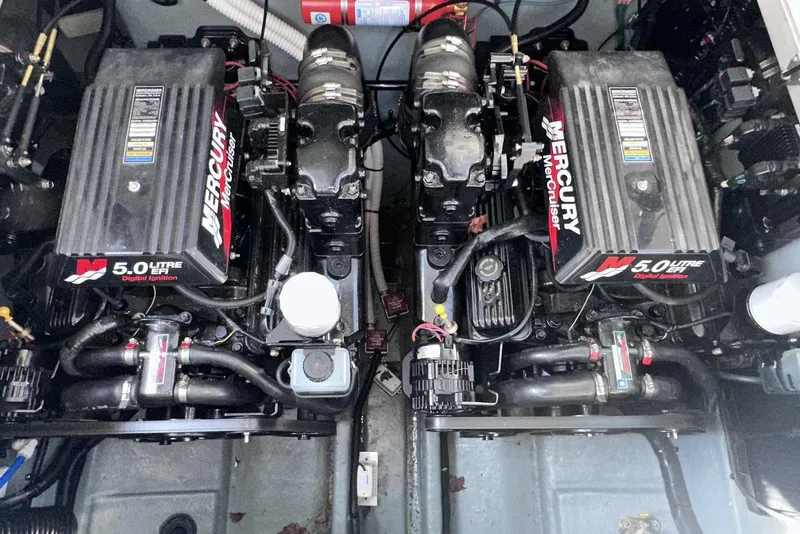 Slide: The Image of Engine compartment of a 2000 Sea Ray 290 Sundancer with twin Mercury 5.0L EFI engines. - 21