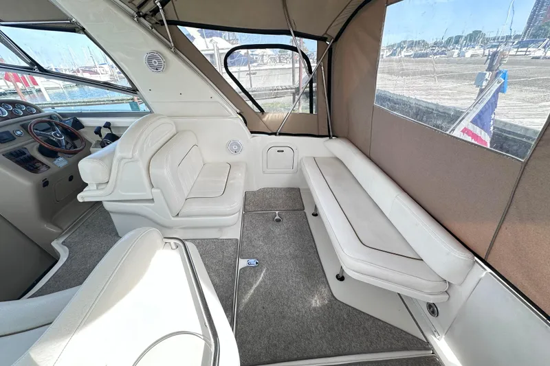 Slide: The Image of Interior of 2000 Sea Ray 290 Sundancer boat with seating and helm. - 3