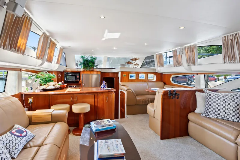 Slide: The Image of Luxurious interior of 2005 Carver 466 Motor Yacht with elegant seating and modern amenities. - 12