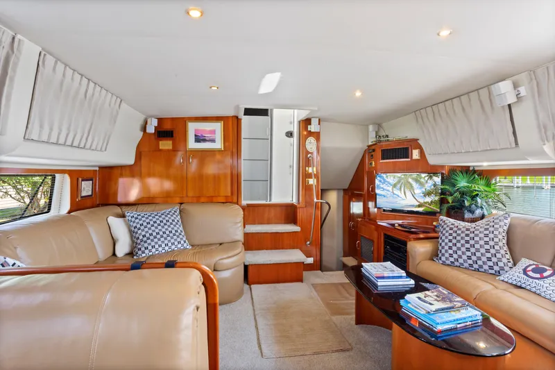 Slide: The Image of Luxurious interior of 2005 Carver 466 Motor Yacht with leather seating and modern decor. - 13