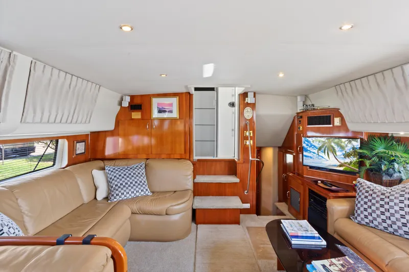 Slide: The Image of Luxurious interior of 2005 Carver 466 Motor Yacht with plush seating and elegant decor. - 14
