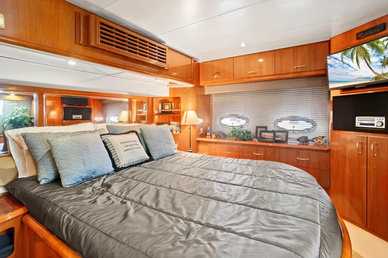 Slide: The Image of Luxurious bedroom interior of 2005 Carver 466 Motor Yacht with elegant wood finishes. - 20