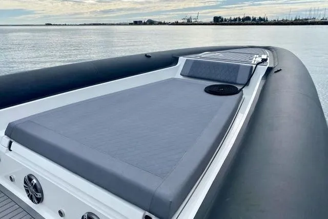 Slide: The Image of 2026 Northstar ION 12 boat with sleek deck design on calm water. - 9