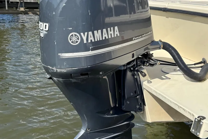 Slide: The Image of 2011 Parker 2510 XL Walkaround with Yamaha outboard motor on water. - 12